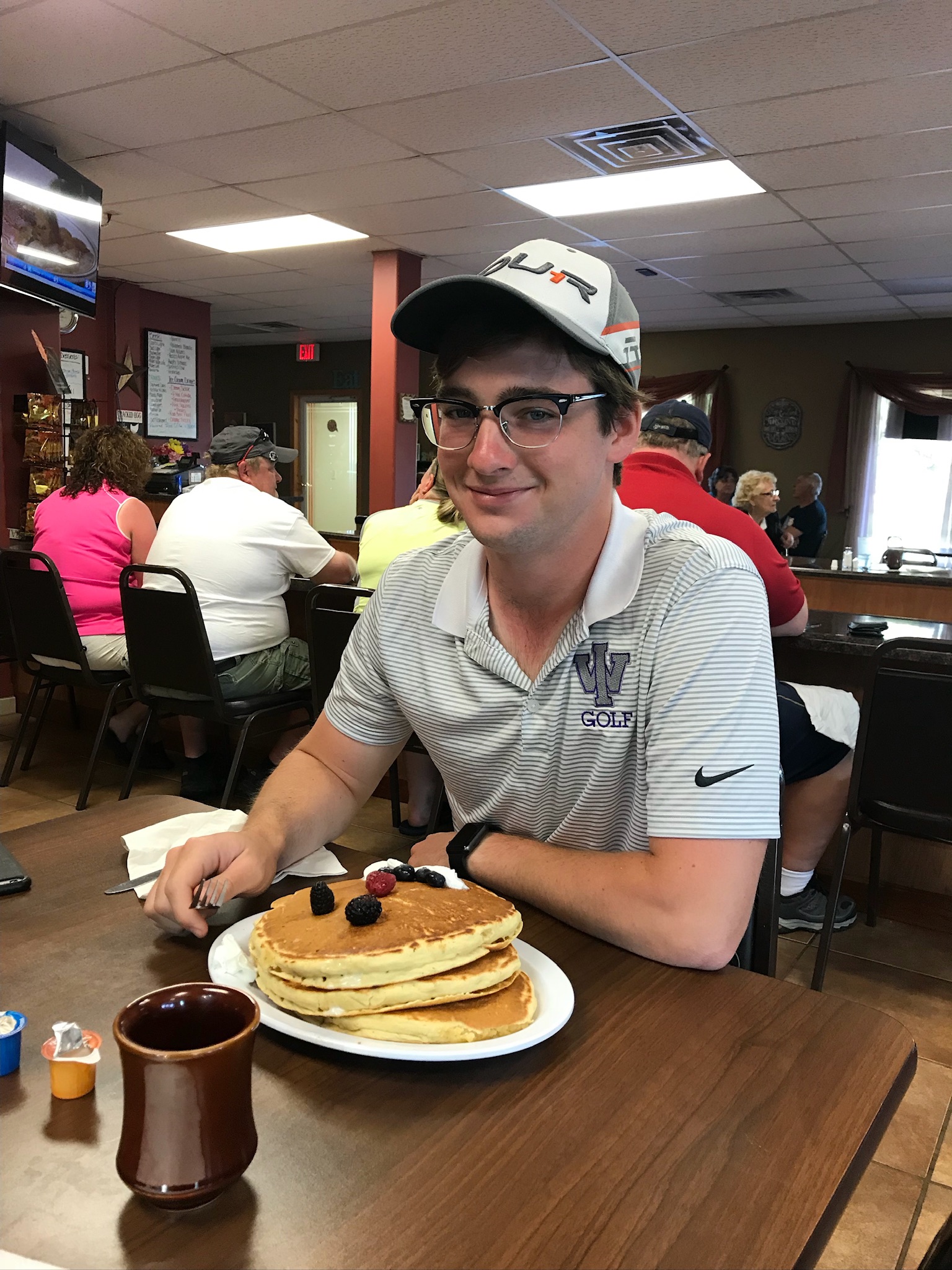 Austin Willis at breakfast with pancakes