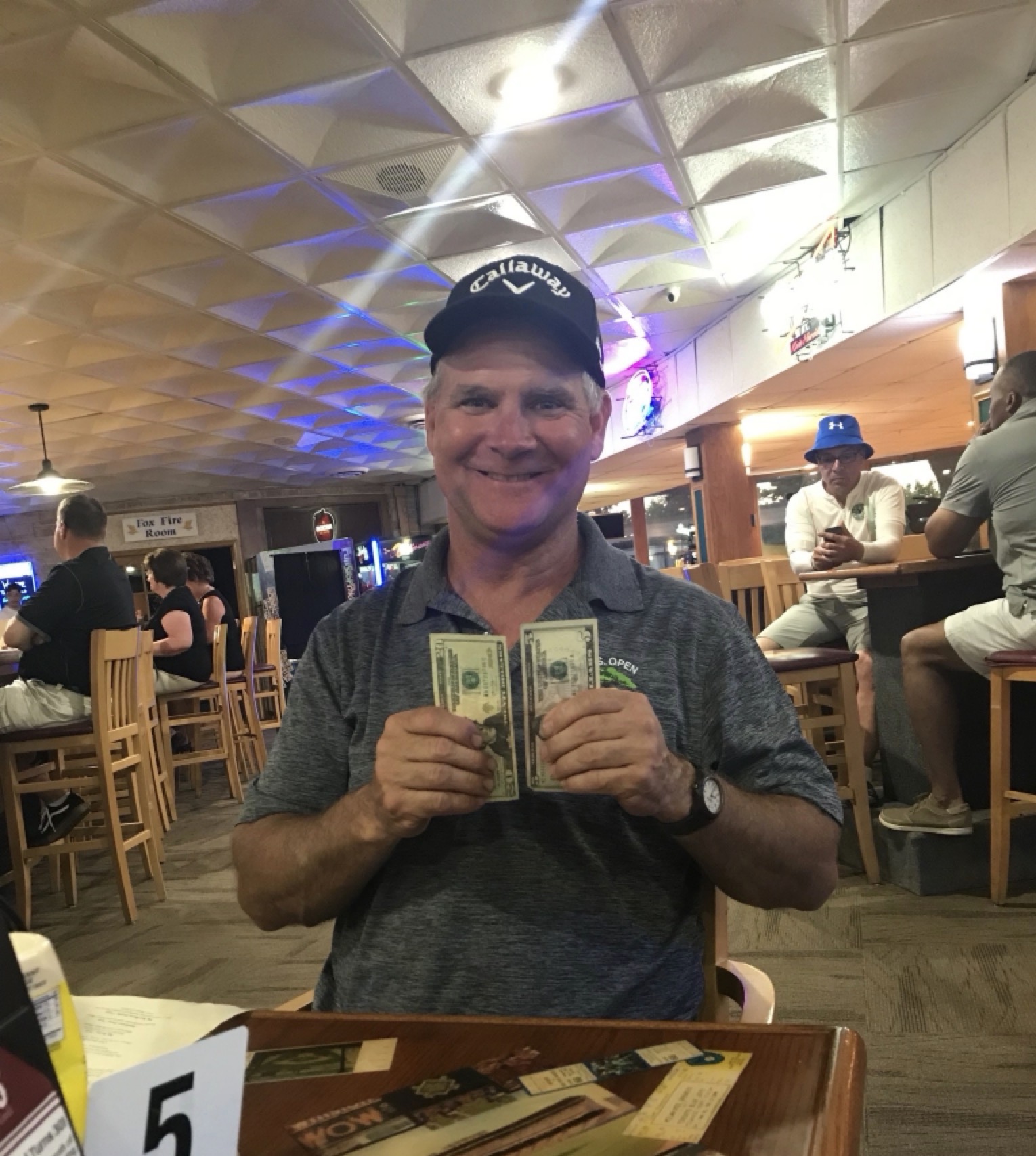 Bryan Willis holding up his winnings