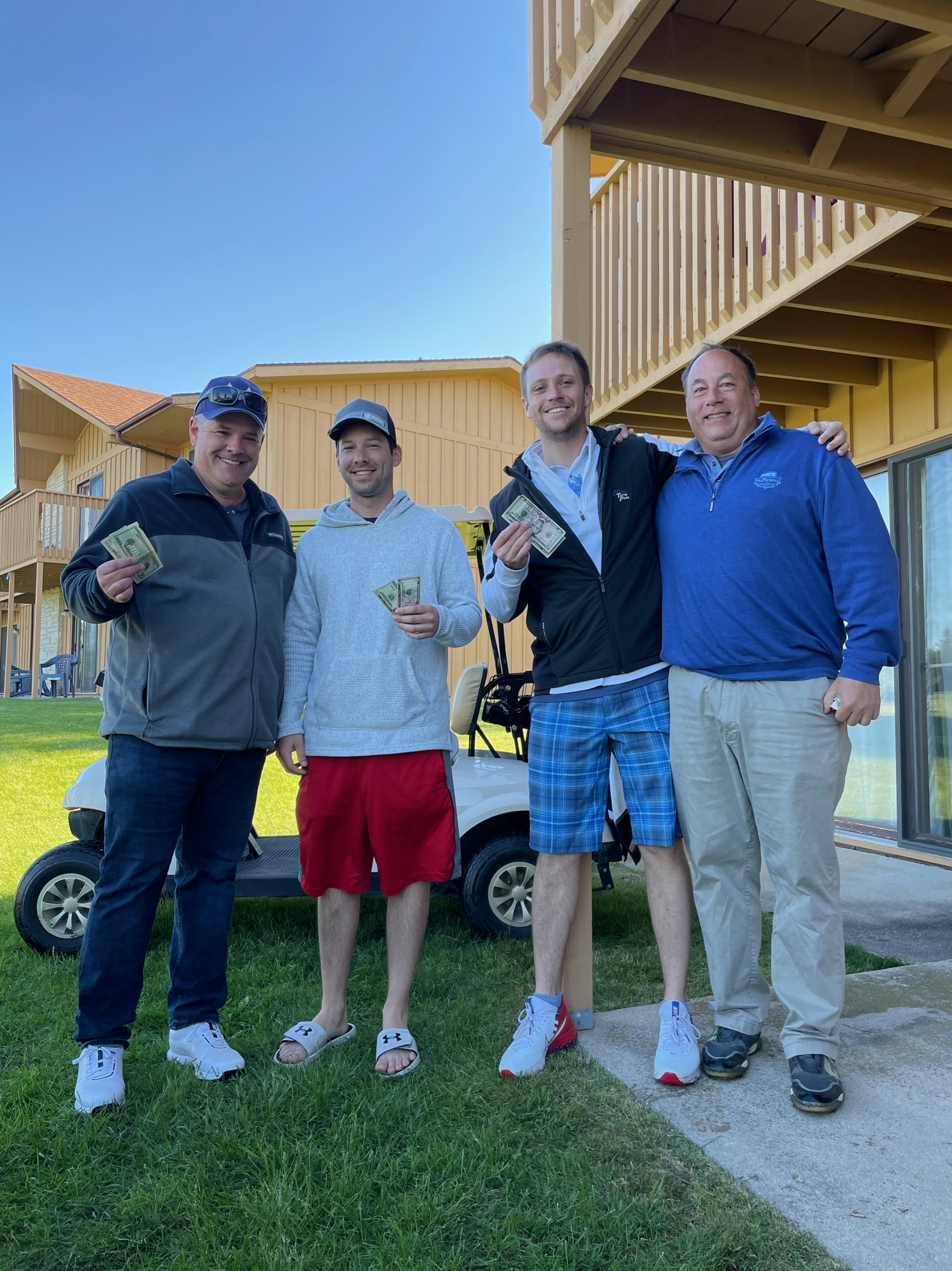 Jake, Dean, Ryan, and Bob posing with winnings